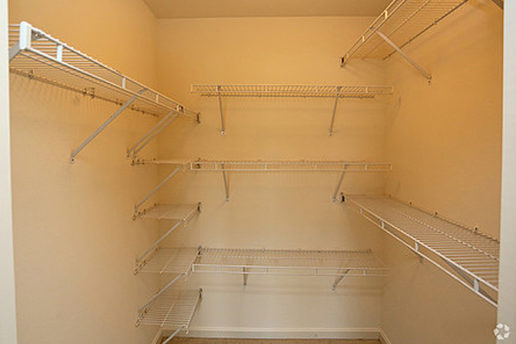 Walk in closet with shelving 
